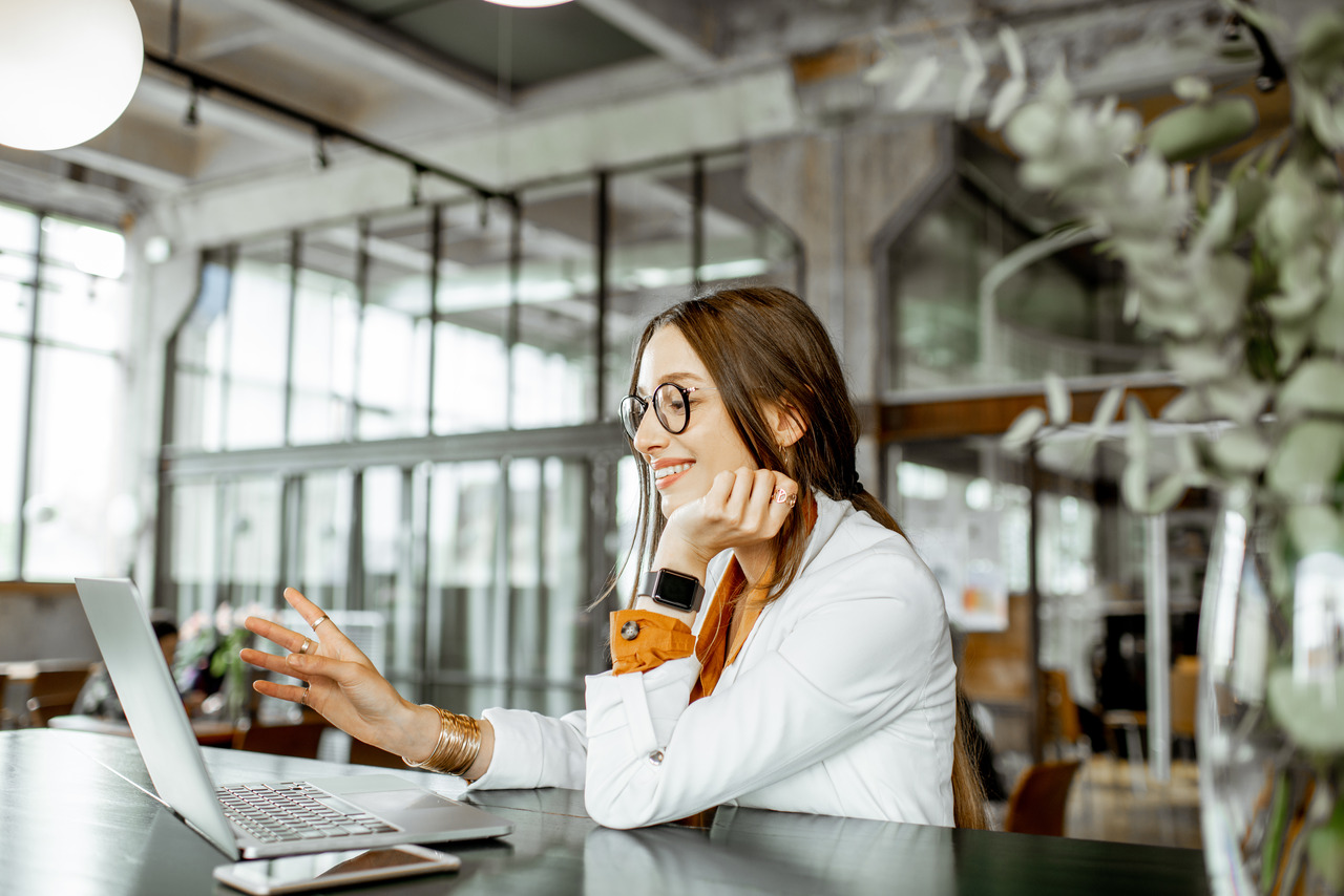 Young woman doing a data backup on laptop